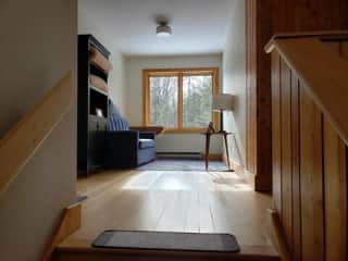 Top of stairs with pull out bed and reading nook.