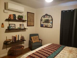 The sitter's bedroom has blackout curtains, a ceiling fan and "minisplit" air-conditioning, in addition to lovely decor and central air and heat.