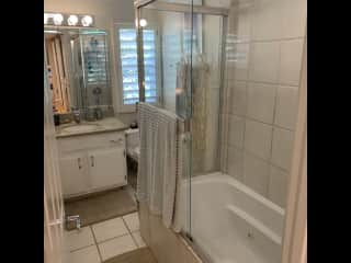 Your bathroom with shower/tub combo.