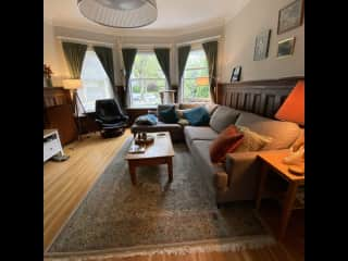 Welcome to the living room! High ceilings and tons of natural light. East-facing windows have the best sun in the morning. (this photo was taken on a particularly grey May day)