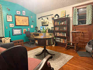 The office is a cozy spot to read a book or use the desk (the computer will be logged out, so bring your own!). Feel free to borrow a book, just be sure to put it back when you're done!
