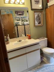 Powder room in room with laundry