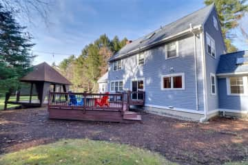 Side view of house, outdoor patio.