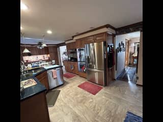 Kitchen and breakfast nook  Hallway leads to front door