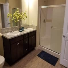 Dual sink bathroom with walk in shower. Super hot water.