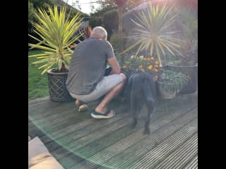 Reo helping Marc in the beautiful garden he has created.