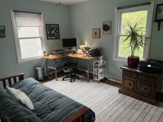 Office space upstairs with desk, second screen, and printer