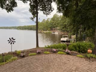 Paved patio area is between deck and dock. View is of western shore.