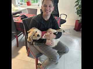 Jeremy playing with of our friend's puppy, (Golden Retriver) Bibi.