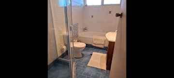Bathroom has shower and bath