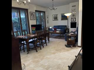 Living room with piano and access to garden terrace