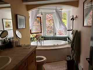 Romantic Bathroom showing the jacuzzi tub, which is also a shower.