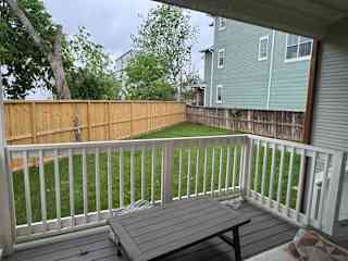 Back patio (accessed from living room) and yard