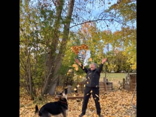 Luna & Dori playing in leaves in fall.