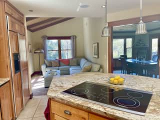 view from kitchen of sun room and dining room