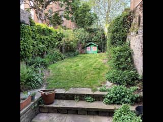 This is our garden. There is a Wendy House at the far end, and space for children to play.