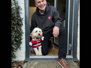 Mark is the one smiling.  Montie is one of the dogs we cared for in the UK, he did not agree to the outfit.