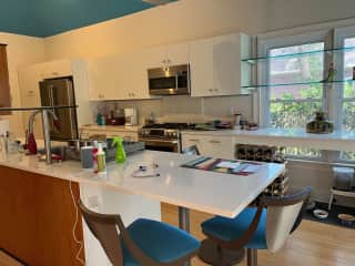 Kitchen Counter has eating space for 3.  You can just see the cat food area under the windows.