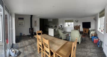 Panoramic photo of dining/living area