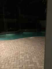 Screened in pool area for an evening dip or just enjoying the night.  There is a gas grill, charcoal grill and pellet grill to choose from!