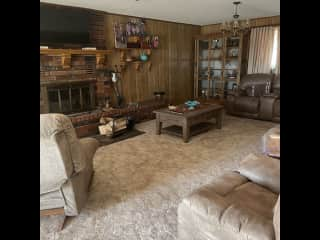 Large spacious living room with fireplace and room to lounge by the fireside.