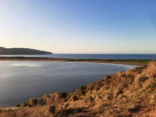 Another view from the field. Fermoyle Strand is on the other side of the spit. You can get to it by walking along the road, or by walking around the spit.