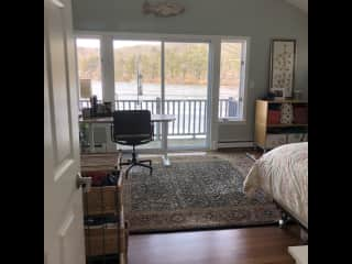 Master bedroom looking over the water.  You are welcome to work at my desk.