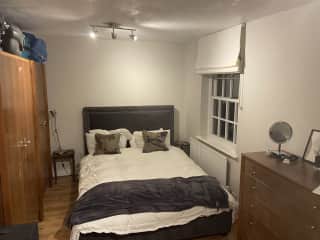 Guest bedroom with desk and views