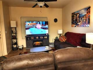 Living Room.  Couch, loveseat, fireplace, 65" TV, multiple streaming apps.