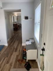 Entryway to living room and kitchen