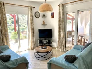 Our living room has sea and garden views and is cosy.