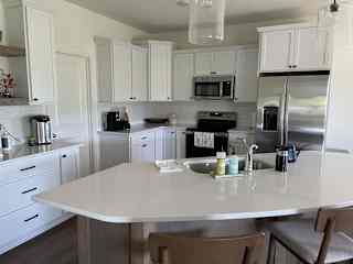 Kitchen area includes dishwasher, Keurig, and water warmer for tea.