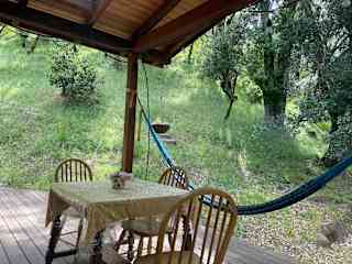 Come dine on our porch or relax in the hammock!