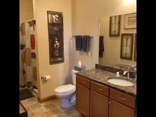 We have three bathrooms.  This one is on the first floor with a shower, no tub, just off the guest bedroom.  The laundry is also in this bathroom.