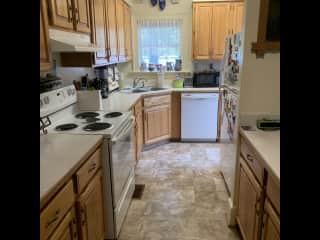 Basic but functional kitchen with new refrigerator with ice maker, instapot,small appliances, pantry.
