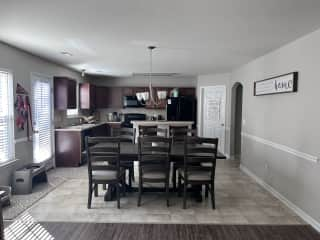 Looking at our dining room table and kitchen from the family room.