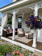 Front porch seating overlooking garden