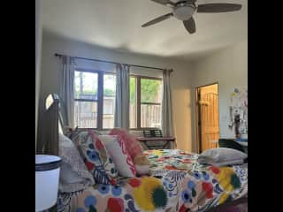 Downstairs bedroom with en suite. You can sneak a peak at the catio outside the window.