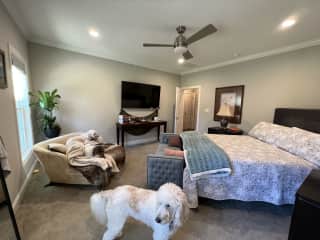 Main bedroom where everyone loves to hang out. Windows face backyard.