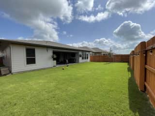 Our spacious backyard provides plenty of room for outdoor games and activities.