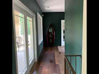 Hall upstairs. Balcony on the left. Office to the right of the canoe