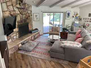 Great Room with working fireplace. TV equipped with steaming services