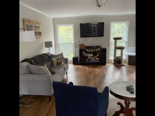 Another view of the den with private, wooded backyard.