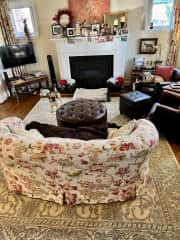 Living room with gas fireplace and cable tv.