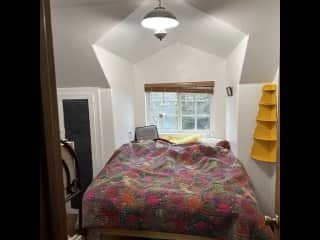 Cozy bed photo of a 'hard to photograph' guest bedroom where you'll enjoy hearing the owls at night!