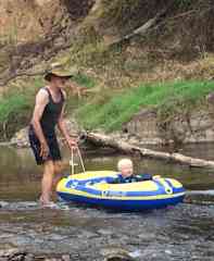 Hanging on to a grandson on the Ovens River canyon. Near Bright township.