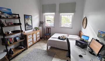 Guest bedroom with work desk and double kitties