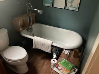 Guest bathroom with an amazing cast iron soaking tub that stays hot for 45min!