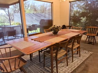 Dining room table with view of covered porch