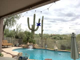 The back porch facing the pool and the 'wash'.  There is a gate from the back yard for walking in the desert if you like